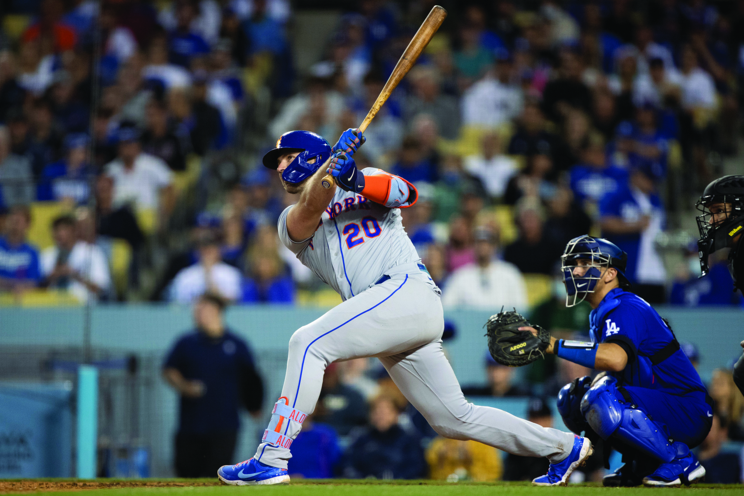 New York Mets' Pete Alonso, left, watches his two-run home run in Los Angeles on Saturday, June 4, 2022
