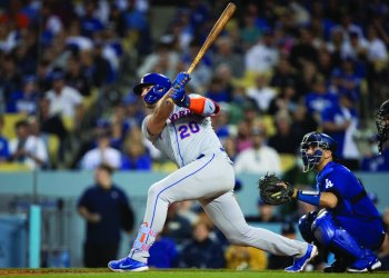 New York Mets' Pete Alonso, left, watches his two-run home run in Los Angeles on Saturday, June 4, 2022