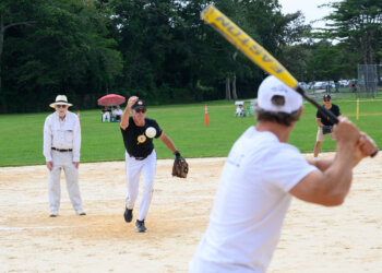 Dan Rattiner served as umpire while Paul Winum pitches at the 2023 Artists & Writers Game