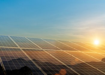 Environmental sustainable energy concept. Solar panels clean energy generating electricity. Photovoltaic cells on the sunset.