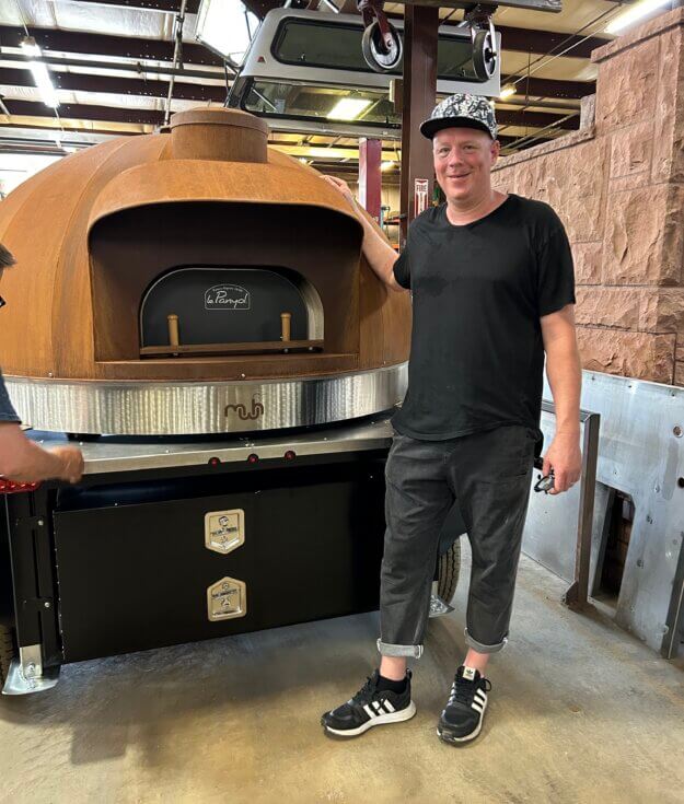 Smillie Pizza owner Justin Smillie and his wood-fired oven