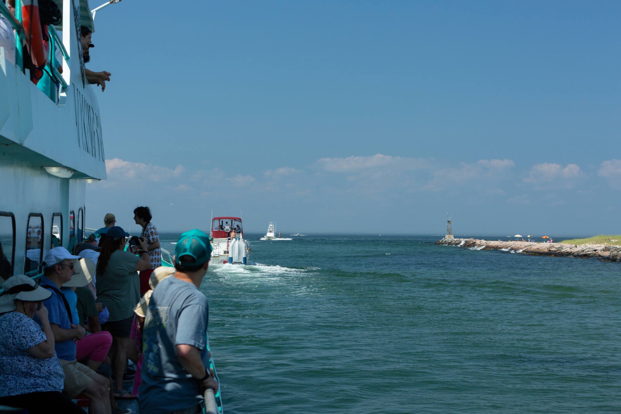 People head out on a whale watching cruise in Montauk, New York on August 06, 2018