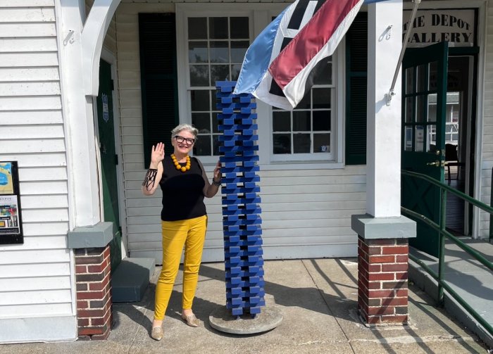 Donna Corvi at the front of The Depot Gallery.