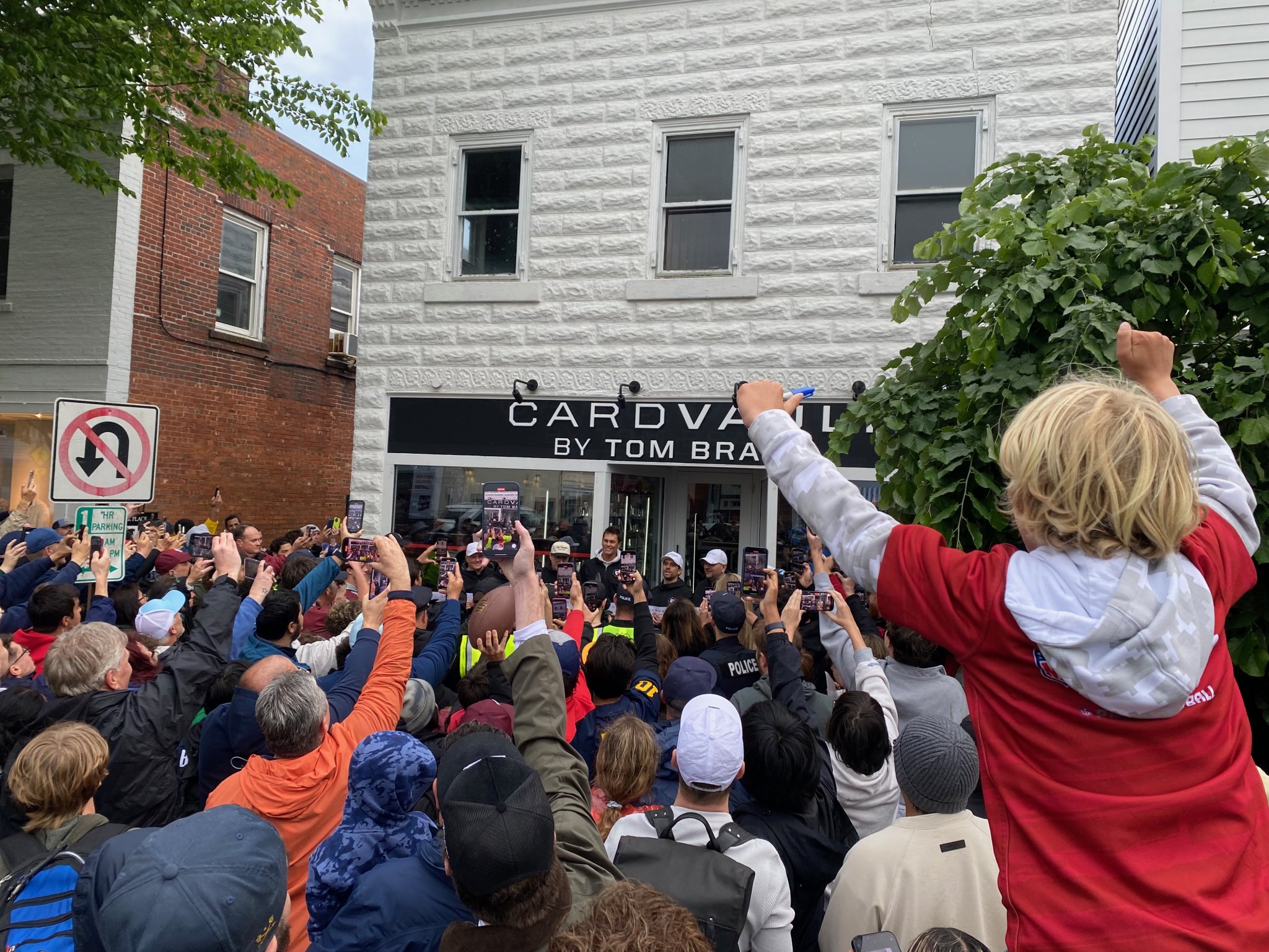 The huge crowd in front of CardVault by Tom Brady on Newtown Lane in East Hampton