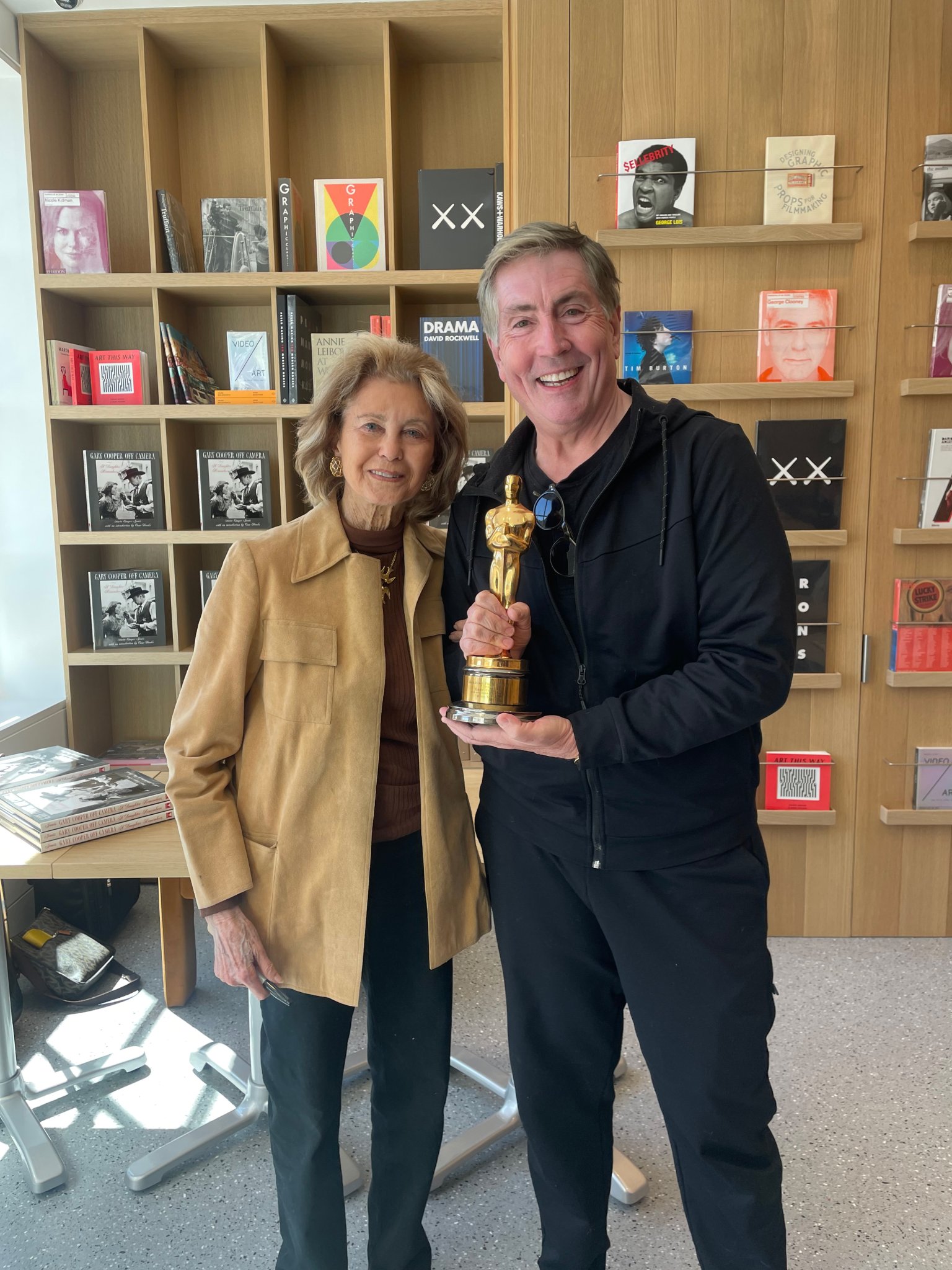 Maria Cooper Janis and Bill McCuddy with Gary Cooper's Oscar