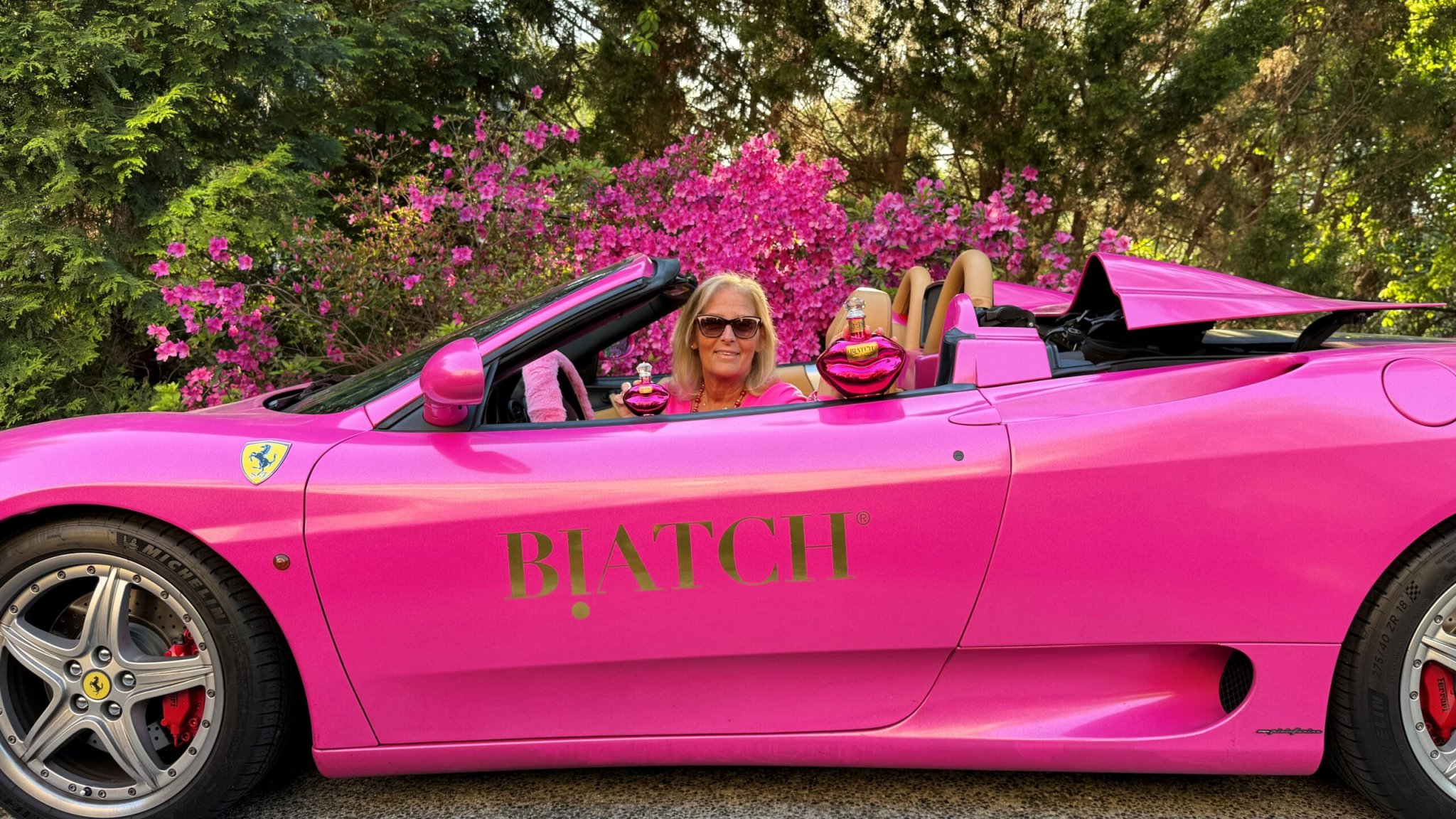 Biatch Tequila founder "Aunt Sue" Hrib in her pink Ferrari