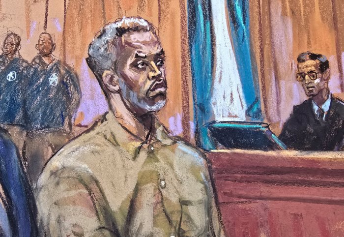 Sean "Diddy" Combs stands as he is arraigned on a superseding indictment ahead of his May trial on sex trafficking charges, in New York, U.S., March 14, 2025, in this courtroom sketch