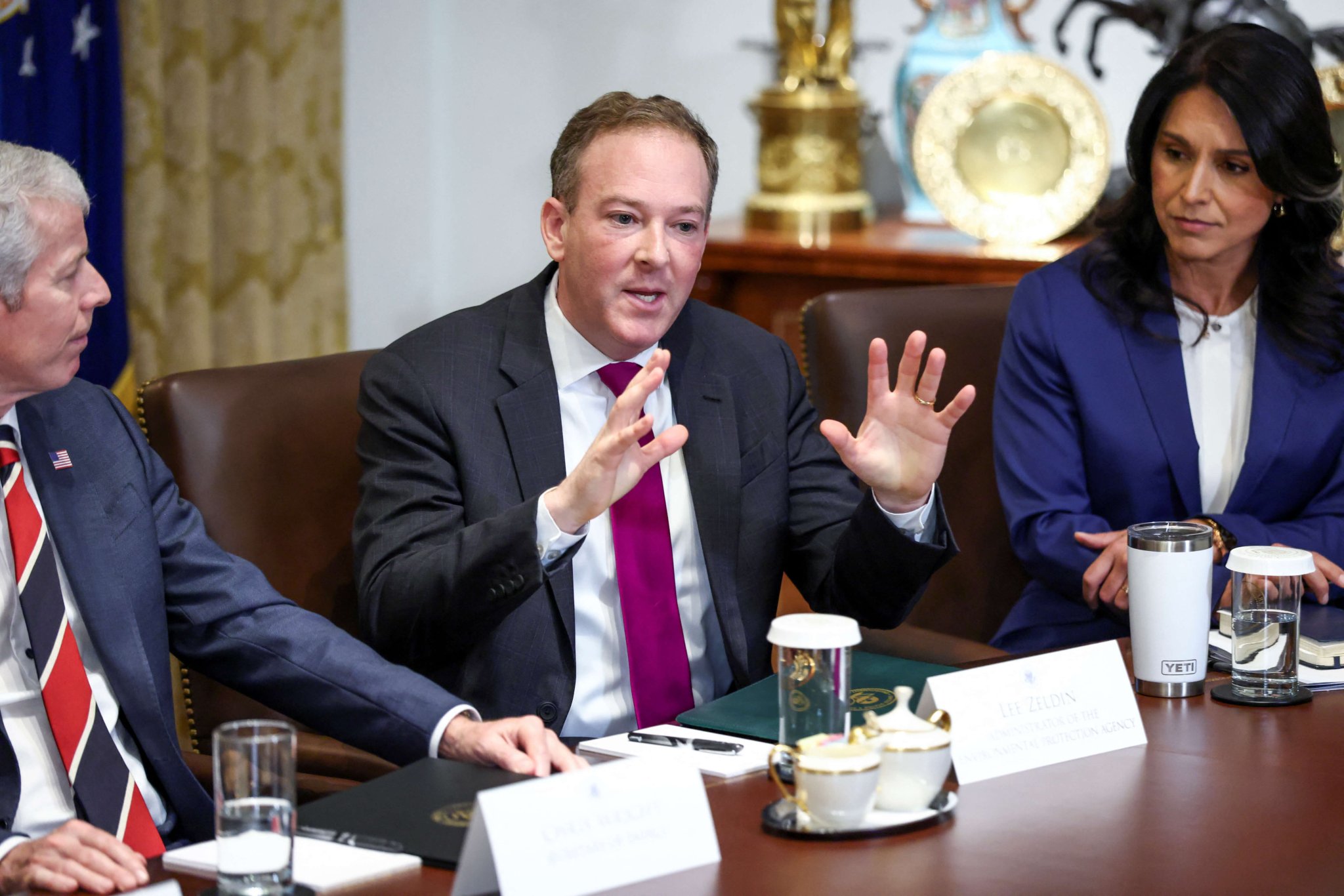 U.S. Secretary of Energy Chris Wright, Environmental Protection Agency (EPA) Administrator Lee Zeldin and Director of National Intelligence (DNI) Tulsi Gabbard attend a cabinet meeting at the White House in Washington, D.C., U.S., July 8, 2025. REUTERS/Kevin Lamarque
