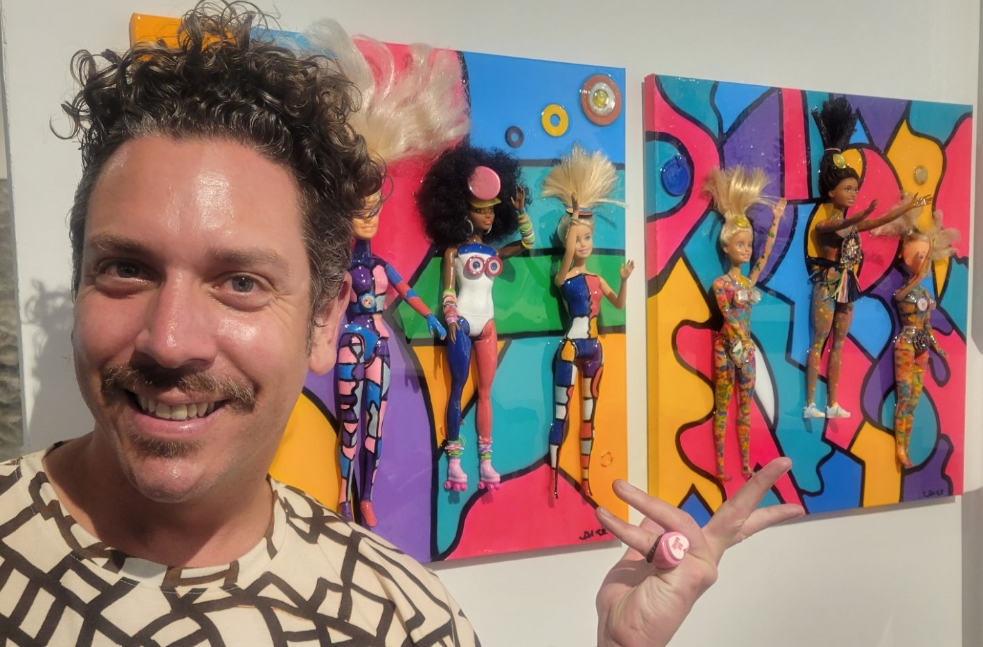 Dylan Smith with his art at the Loves Gallery booth in the 2023 Hamptons Fine Art Fair