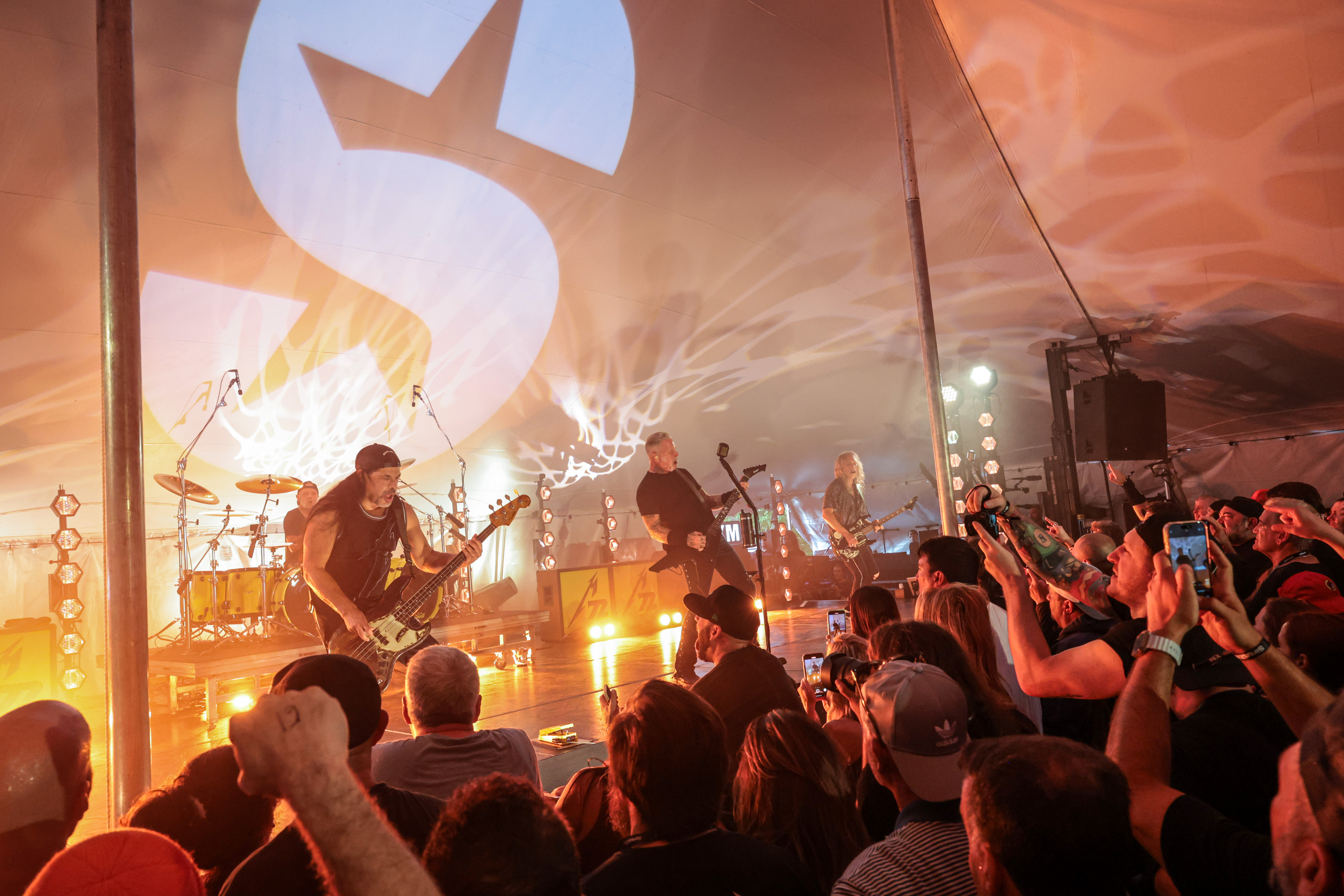AMAGANSETT, NEW YORK - AUGUST 28: (L-R) Robert Trujillo, Kirk Hammett and James Hetfield of Metallica perform live for SiriusXM at Stephen Talkhouse to celebrate the launch of the “Maximum Metallica” channel on SiriusXM on August 28, 2025 in Amagansett, New York.