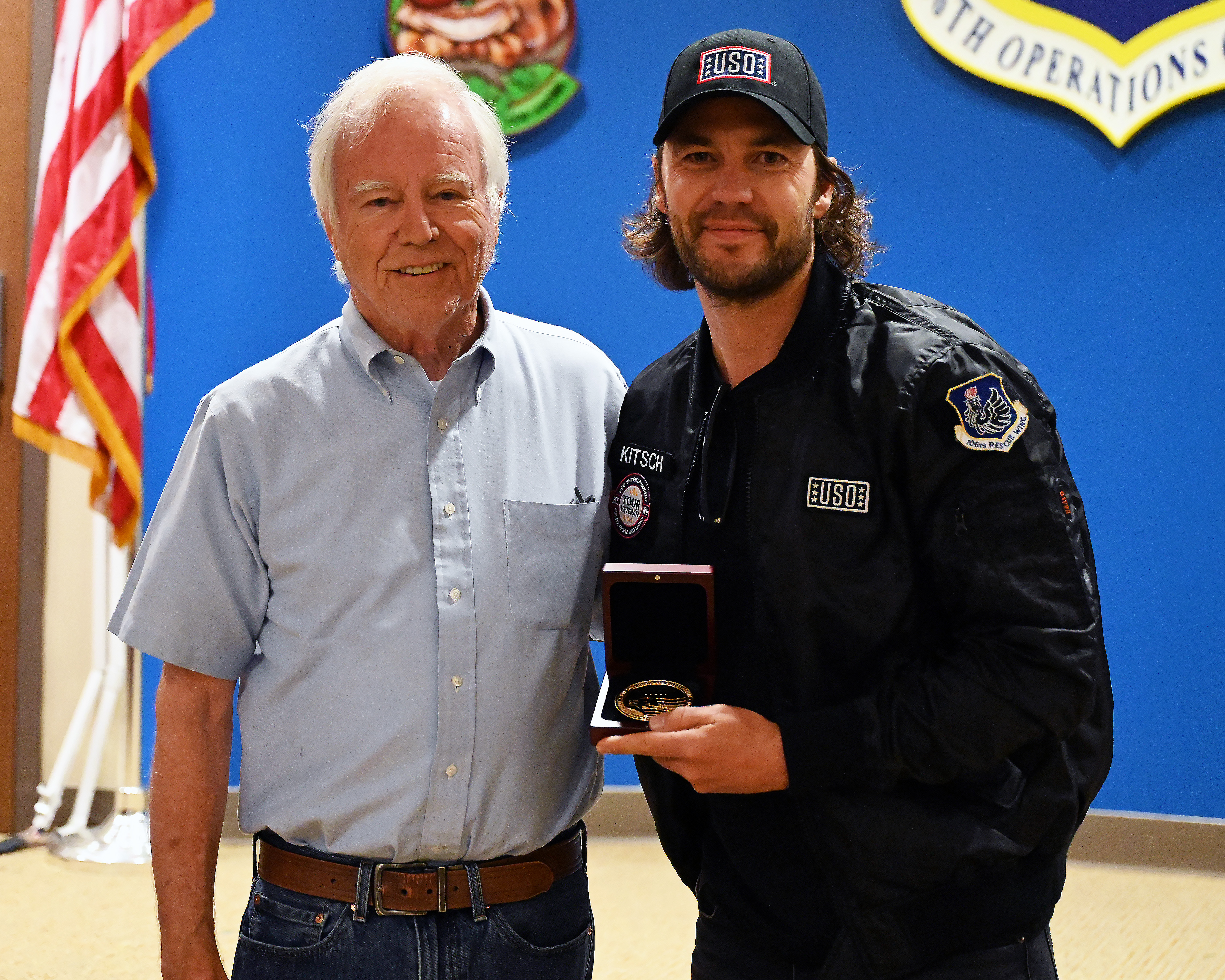 Taylor Kitsch (right) and Dan Murphy (left) take a photo after Murphy presented Kitsch with the Bob Hope Award for Excellence in Entertainment from the Congressional Medal of Honor Society.