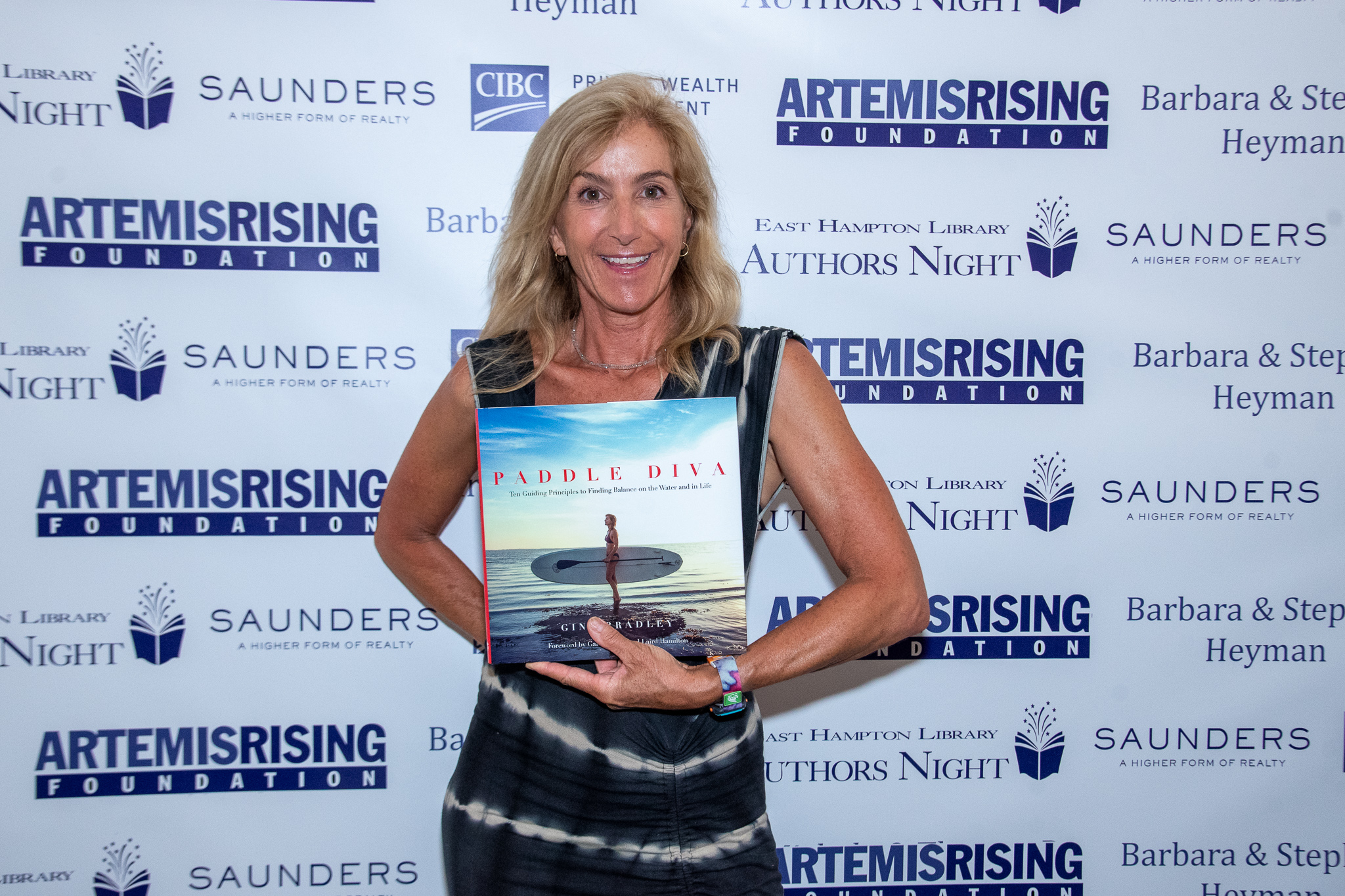 Paddle Diva Gina Bradley shows off her book at Authors Night