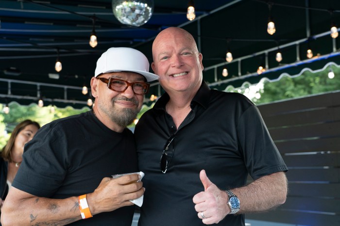 Host Chef Michael Symon and Dan Shaughnessy, CEO of Grill Hampton 2025 presenting sponsor Wilmington Trust.