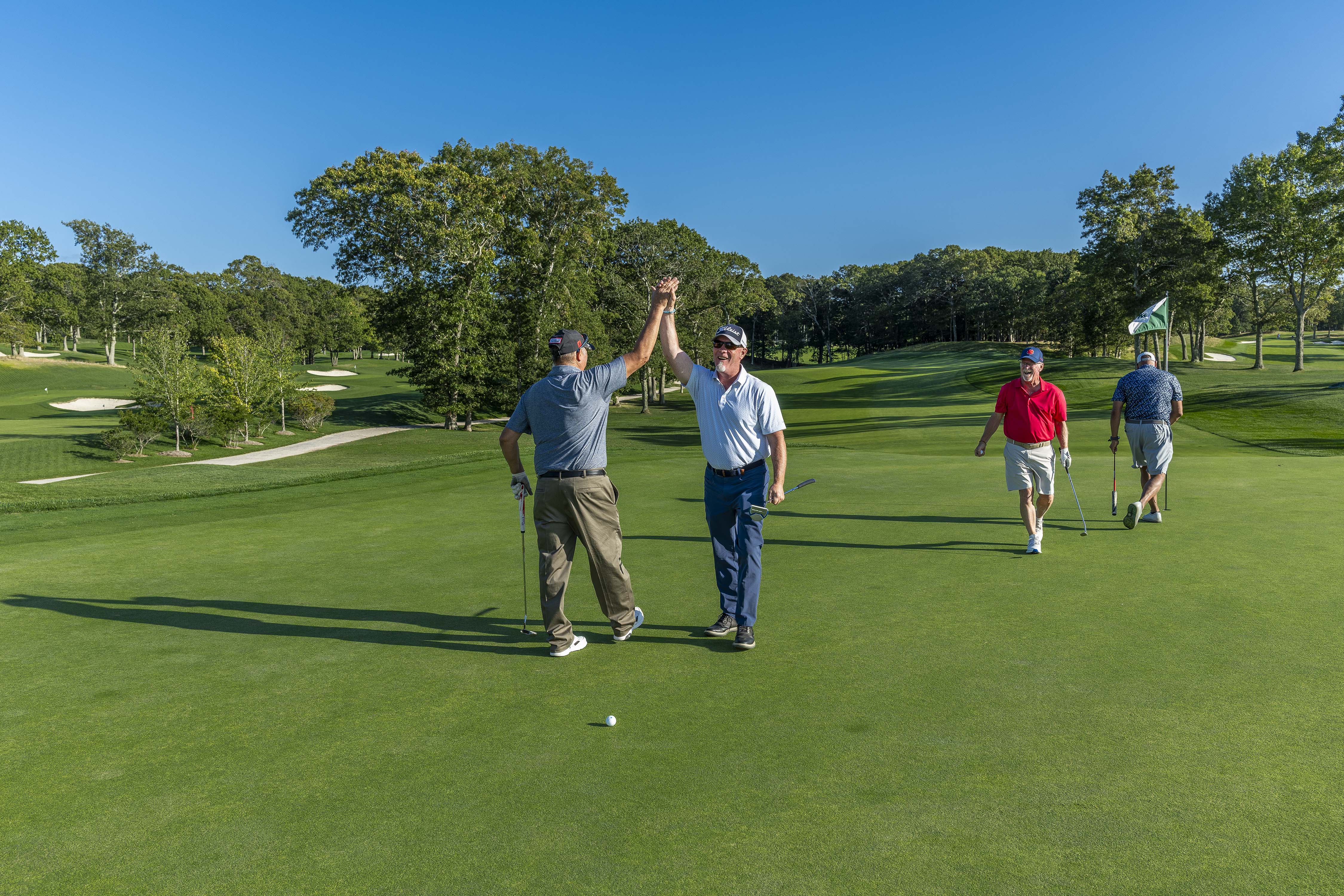 Ray Harden, pictured in the red shirt, celebrated a great shot with his foursome at The Retreat’s Annual Golf Outing on September 22, 2025. Mr. Harden, co-owner of Ben Krupinski Builder, was the event’s Honoree