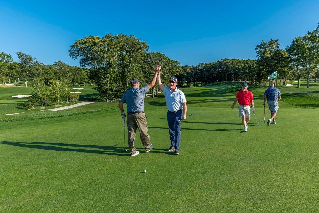 Ray Harden, pictured in the red shirt, celebrated a great shot with his foursome at The Retreat’s Annual Golf Outing on September 22, 2025. Mr. Harden, co-owner of Ben Krupinski Builder, was the event’s Honoree