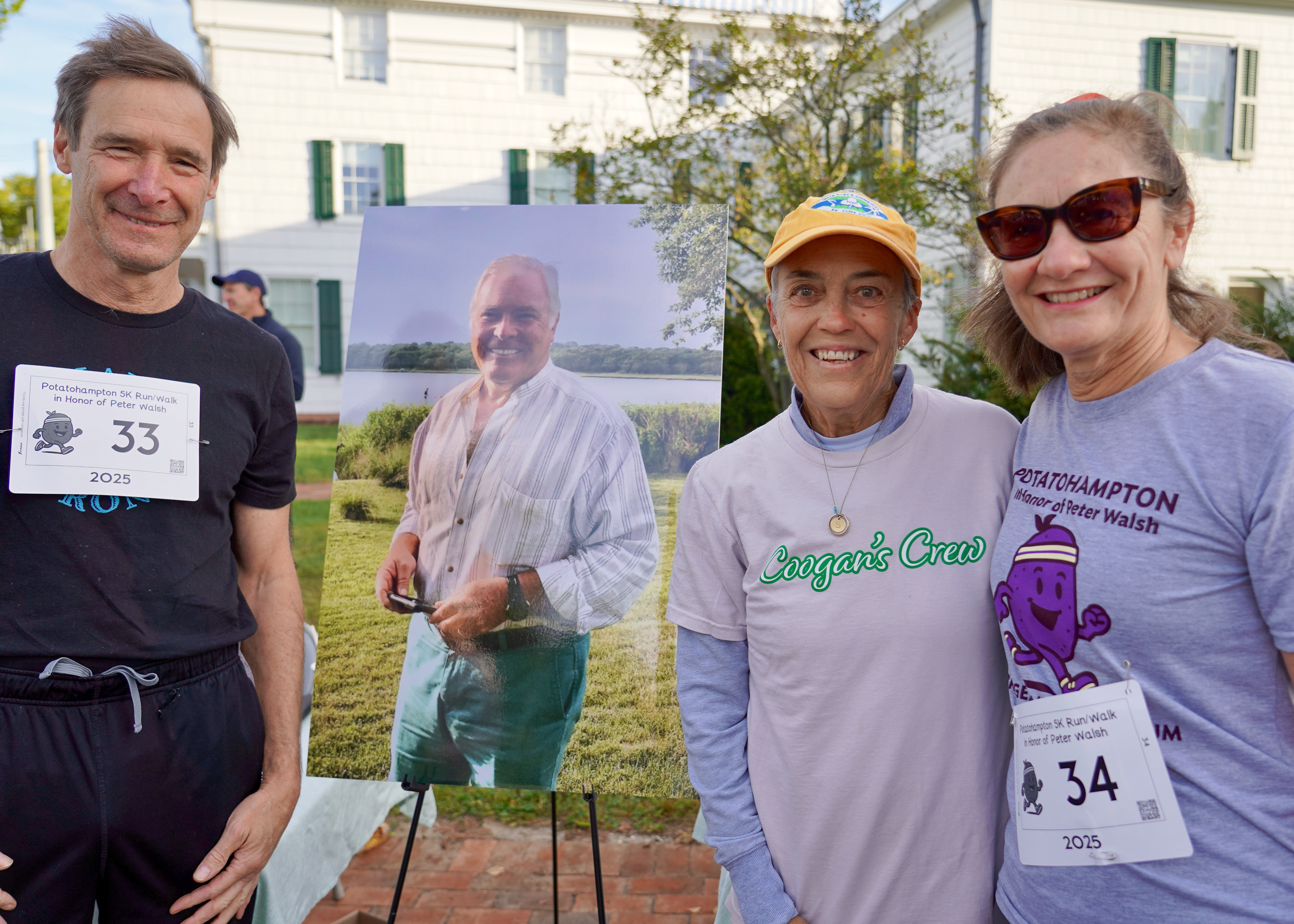 George Thompson, Suzanne Walsh and Lauren Dempsey with photo o