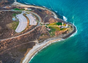 Aerial view over Long Island with Montauk Point Lighthouse and ocean in view (Getty Images)