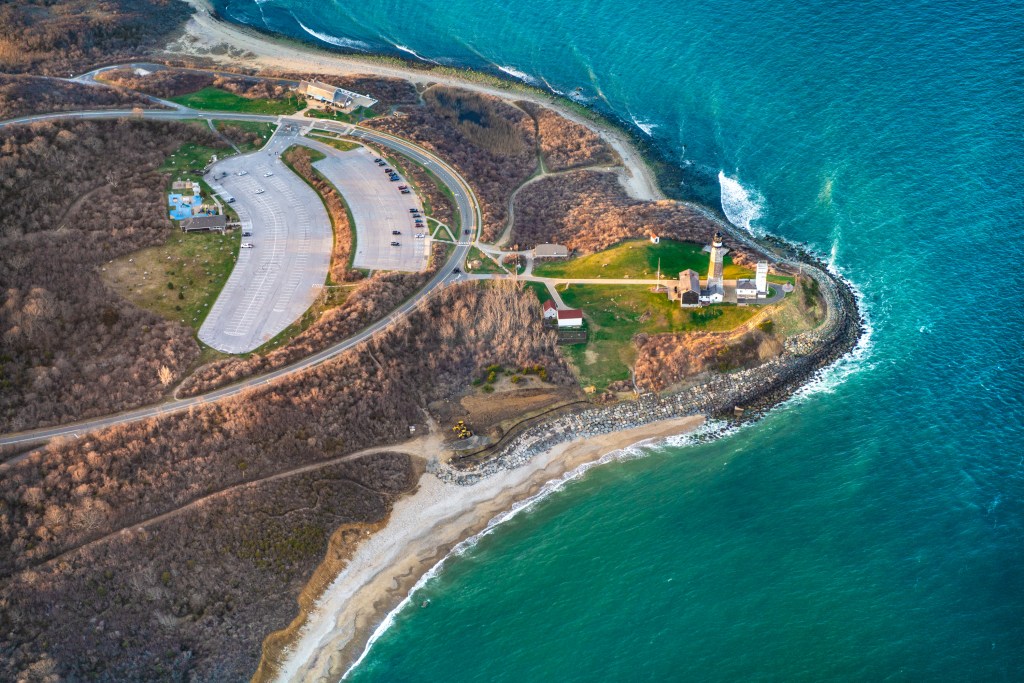 Aerial view over Long Island with Montauk Point Lighthouse and ocean in view (Getty Images)