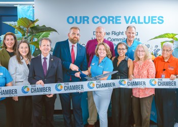 Habitat GPBC staff, board, and supporters cut the ribbon at the new office with Michael Zeff, PresidentCEO, of the Chamber of Comm