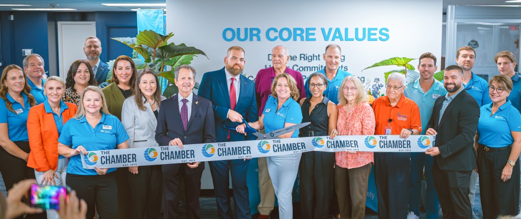 Habitat GPBC staff, board, and supporters cut the ribbon at the new office with Michael Zeff, PresidentCEO, of the Chamber of Comm