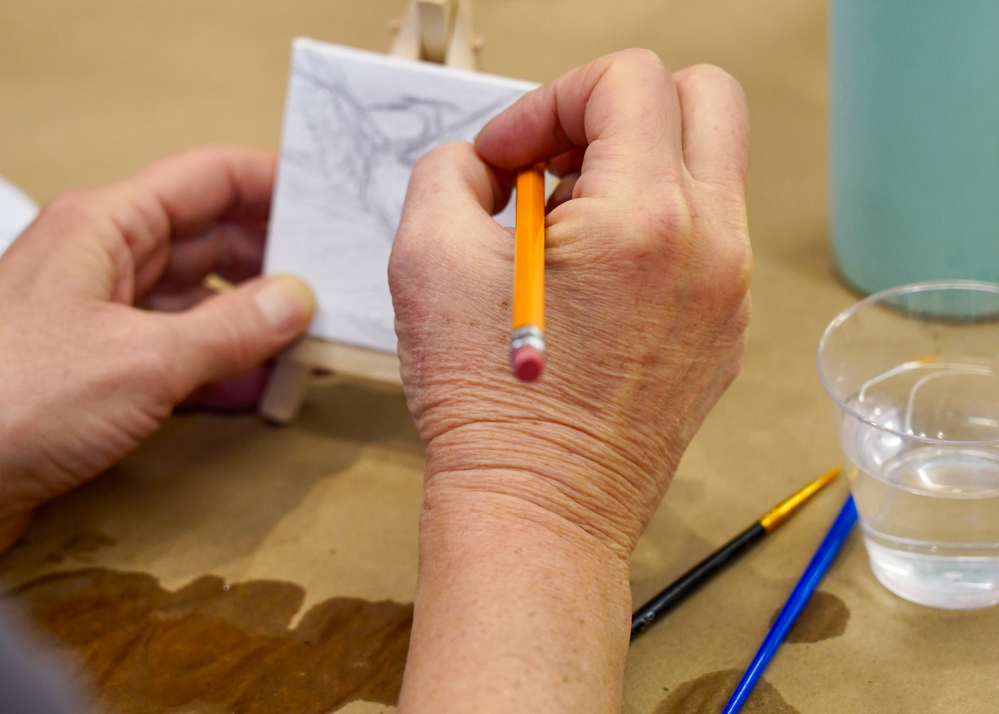 Artist working on her tiny painting
