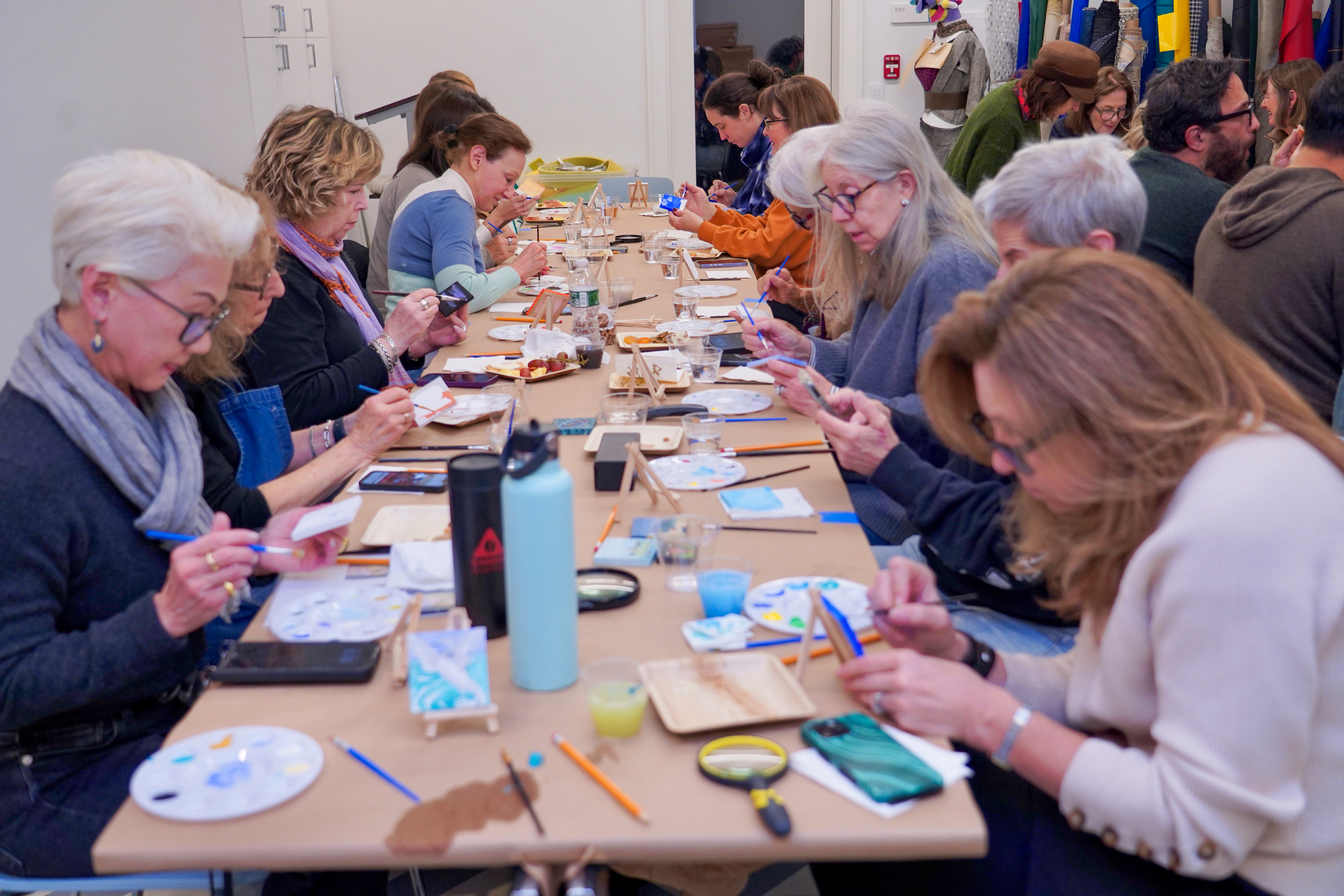 Artists creating their tiny works of art