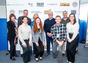 David Brandman and Mayor Jerry Larsen with representatives of the four organizations who are recipients of the donations from this year’s Artists & Writers Game