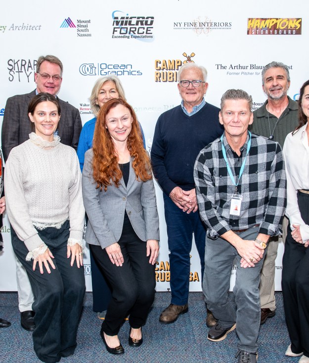 David Brandman and Mayor Jerry Larsen with representatives of the four organizations who are recipients of the donations from this year’s Artists & Writers Game