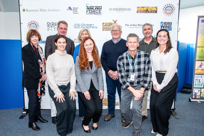David Brandman and Mayor Jerry Larsen with representatives of the four organizations who are recipients of the donations from this year’s Artists & Writers Game