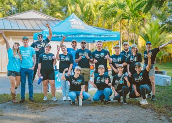 Homeowner Peter Allen and his wife, with volunteers from Carrier, Gunster, Cleartouch, DSS Inc, and Starbucks who helped paint their home