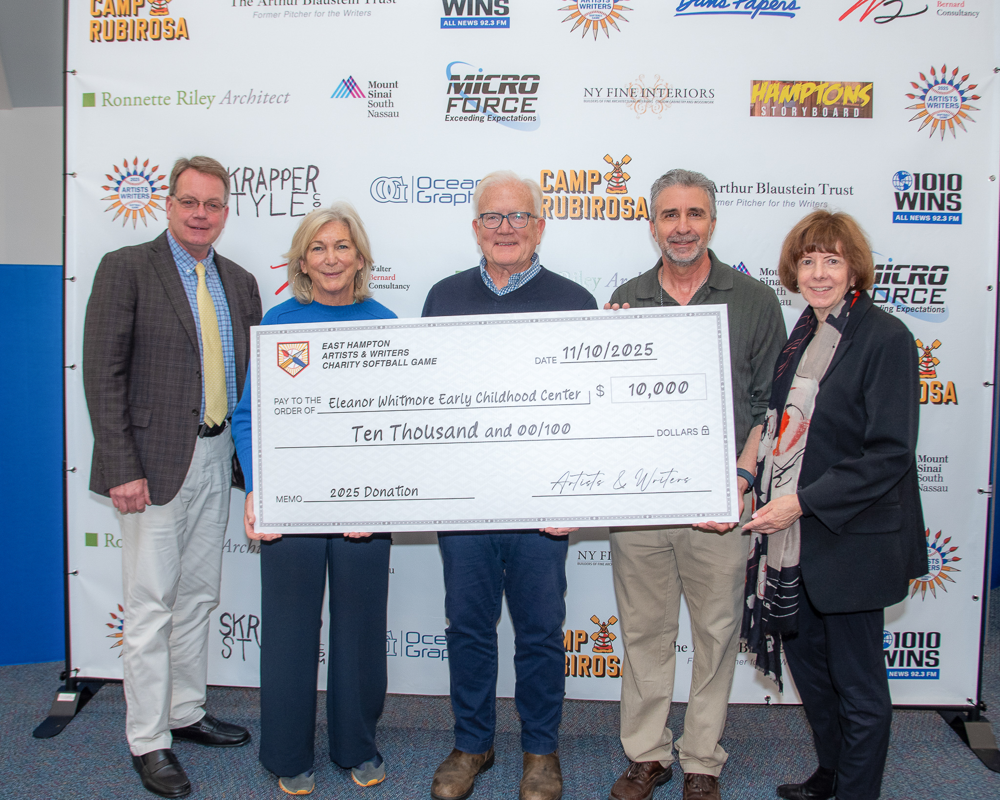 Mayor Jerry Larsen, David Brandman, and Ronette Riley presents check to Joan Overlock and Tim Frazer of the Eleanor Whitmore Early Childcare Center