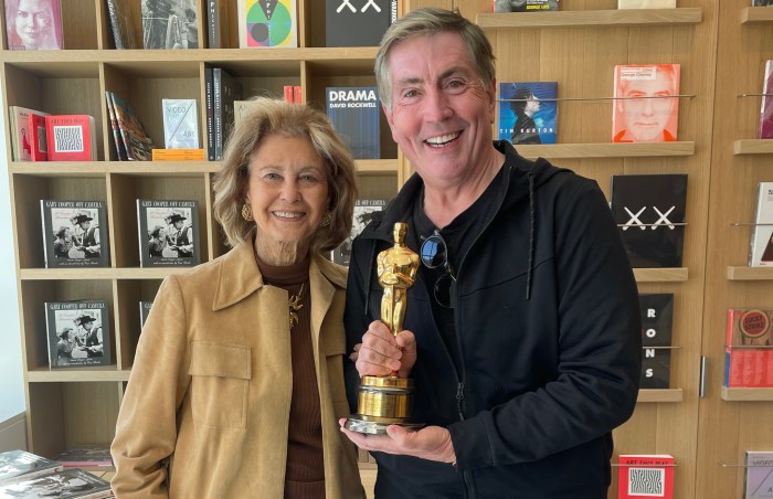 Bill McCuddy holding Gary Cooper's Oscar for "High Noon" with Maria Cooper Janis at a Southampton Playhouse book signing earlier this year.