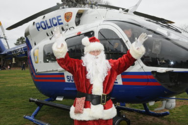 Santa arrives via helicopter!