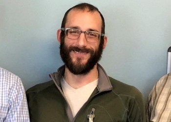 FILE PHOTO: An undated handout image of Alex Pretti, who was fatally shot by U.S. immigration agents as they tried to detain him in Minneapolis, Minnesota, U.S., obtained by Reuters on January 25, 2026. U.S. Department of Veterans Affairs/Handout via REUTERS THIS IMAGE HAS BEEN SUPPLIED BY A THIRD PARTY. MANDATORY CREDIT. EDITORS PLEASE NOTE: THIS IMAGE HAS BEEN CROPPED BY REUTERS FROM THE ORIGINAL PHOTOGRAPH AS TO NOT IDENTIFY THE OTHER PEOPLE IN THE PHOTOGRAPH./File Photo