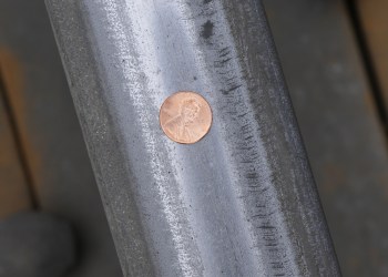 Penny and pennies on Hamptons Subway track