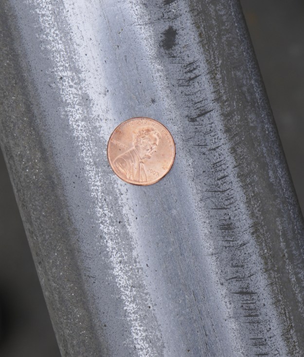 Penny and pennies on Hamptons Subway track