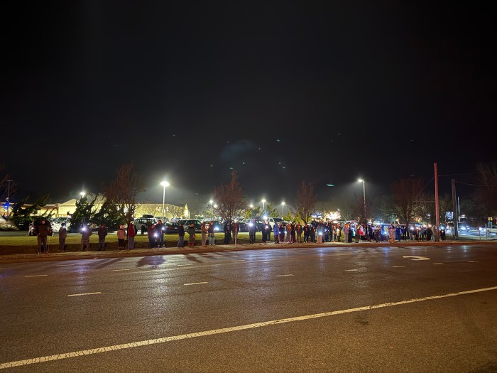 Anti-ICE protestors lined up along Montauk Highway in Hampton bays Friday