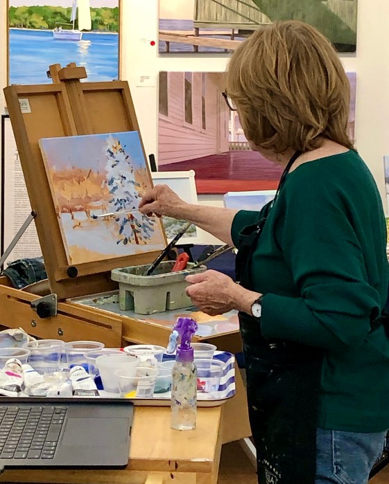 Patricia Feiler painting a winter scene