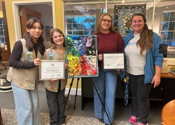 (L to R) Girl Scouts Remy Tryniszewski and Hannah Boyd with Bri Sander and Ellie Sywak of AMSEAS (Atlantic Marine Conservation Society) at the Mattituck-Laurel Library unveiling the Silver Award Project