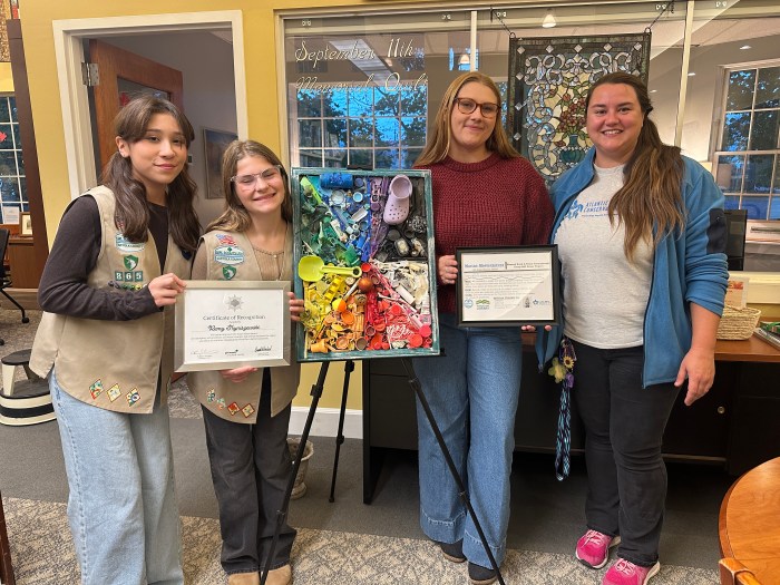 (L to R) Girl Scouts Remy Tryniszewski and Hannah Boyd with Bri Sander and Ellie Sywak of AMSEAS (Atlantic Marine Conservation Society) at the Mattituck-Laurel Library unveiling the Silver Award Project