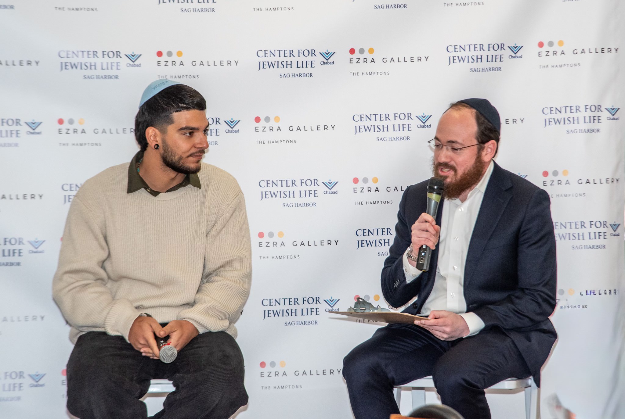 Former Hostage Yosef Chaim Ohana and Rabbi Berel Lerman.