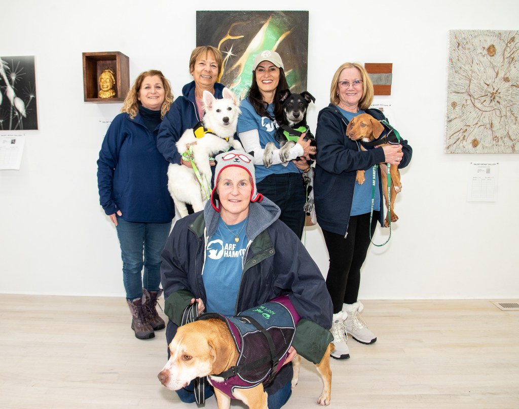 Jamie Berger, ARF Marketing Director with ARF volunteers and adoptable dogs