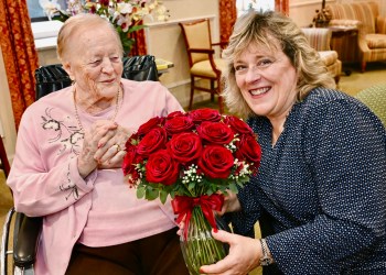 A resident at one the Carmelite System homes with a family member.