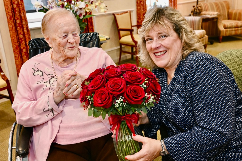 A resident at one the Carmelite System homes with a family member.