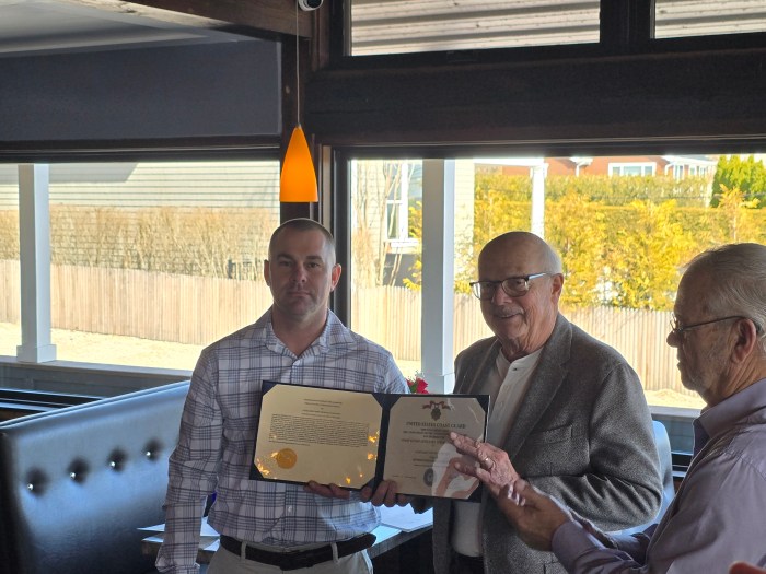 John Nicholson, Vice Flotilla Commander of Southold Flotilla   is awarded an AuxiliaryAchievement Medal by Chief Warrant Officer Christopher Skala  Station Shinnecock Commanding Officer. 