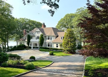 Waterfront Hamptons style house photo, and one below it with the porch, showing the water and dock or town of Huntington