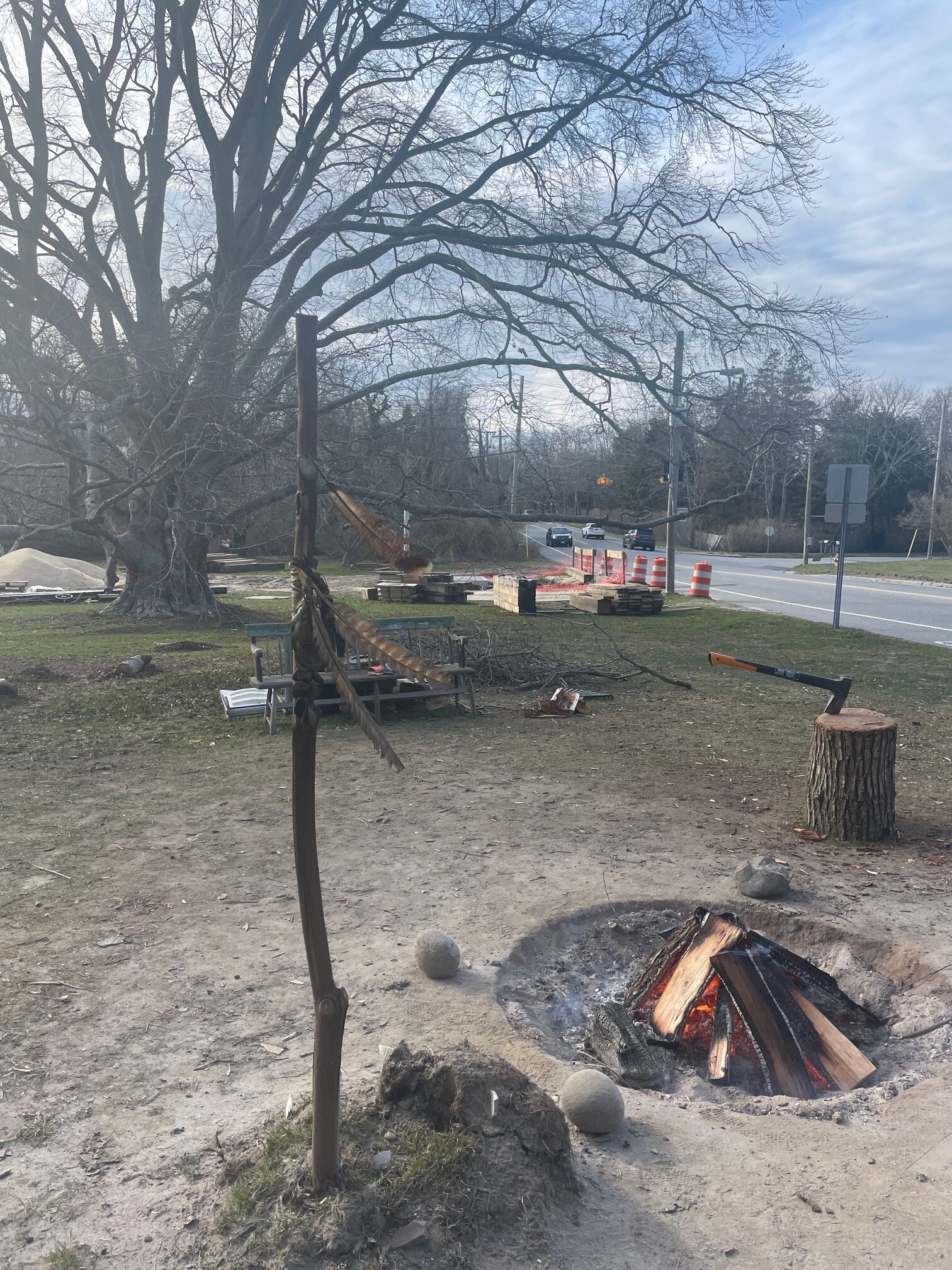 Members of the Shinnecock Nation maintain a fire at the point where Shinnecock meets Hill Street to assert their sovereignty over the edge of land where the Village of Southampton issued permits for National Grid to dig, putting a Beech Tree at risk.