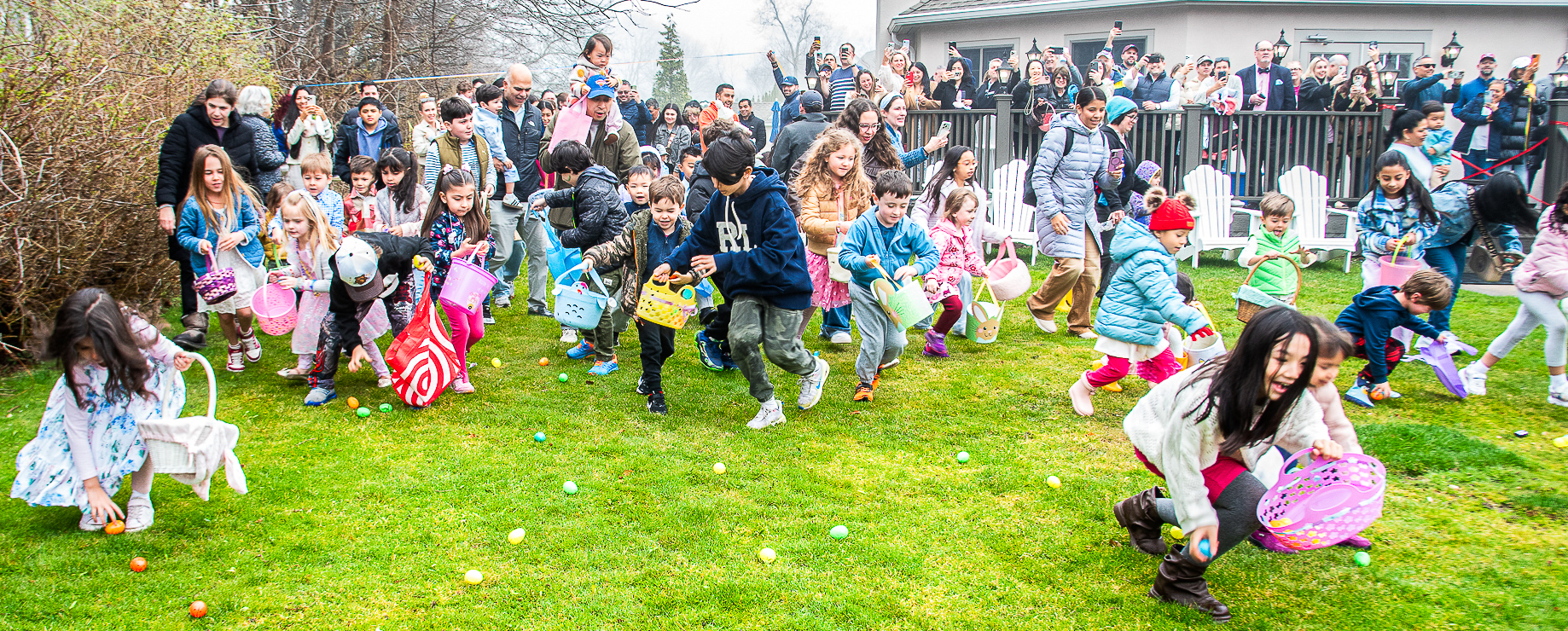 Kids dash across the lawn to kick off the annual Easter egg hunt