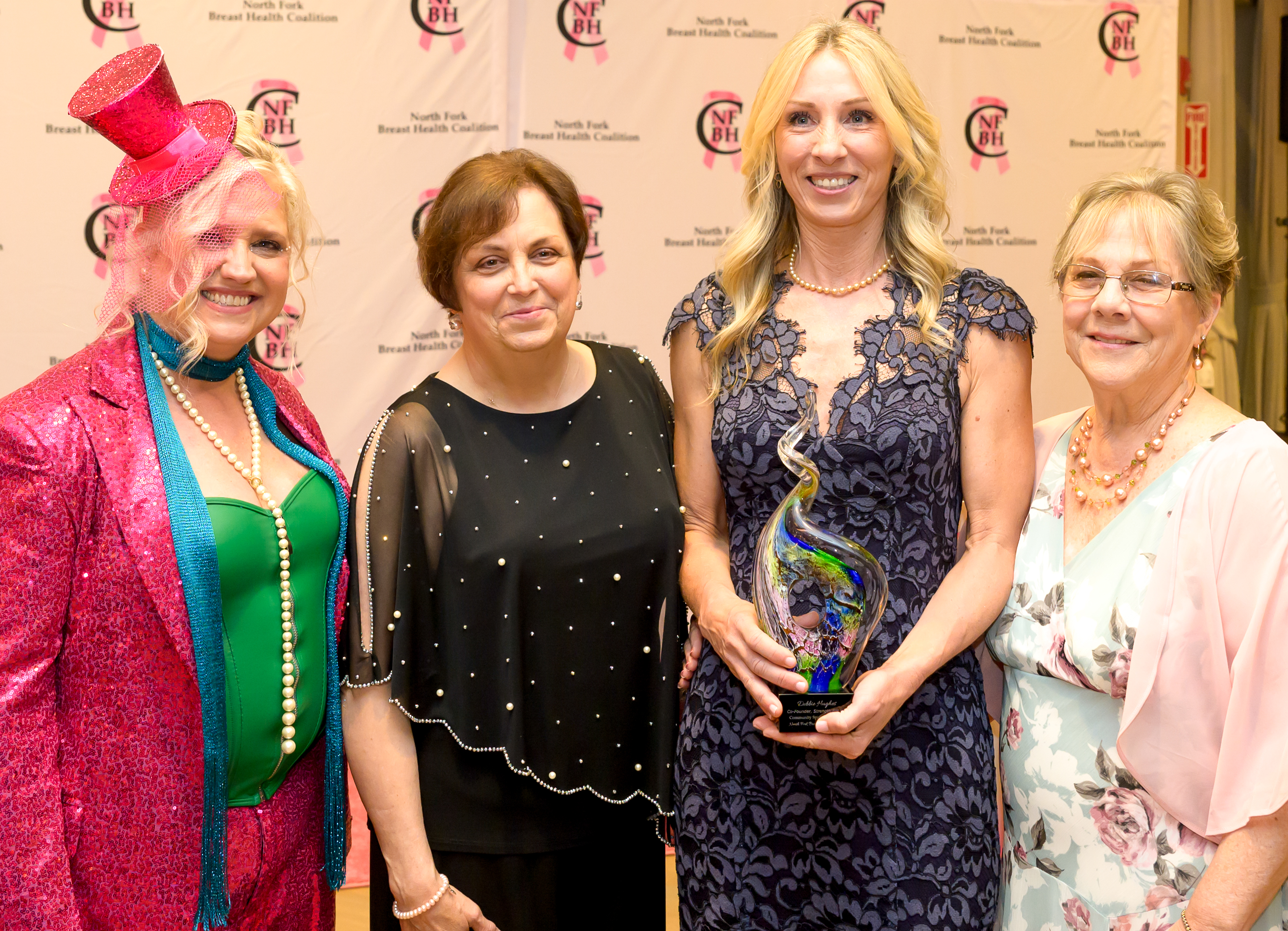 Melanie McEvoy Zuhoski, Susan Ruffini with Champion Award recipient Debbie Hughes, and BeeJay Ferrucci
