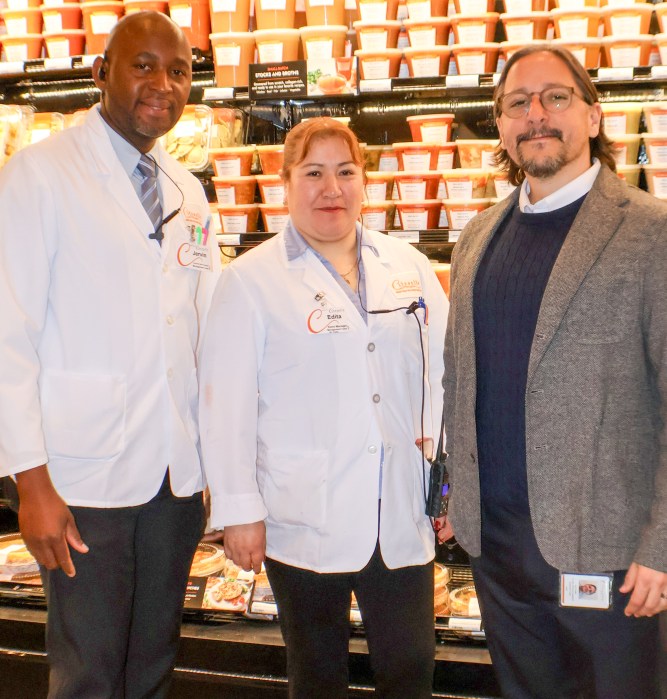 Assistant Manager Jervin Green with Store Manager Edita Lucero, Senior Director of Operations Lau Zarate